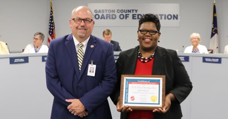 Beam Elementary assistant principal Deon Kennedy pictured with Board Chairman Jeff Ramsey.